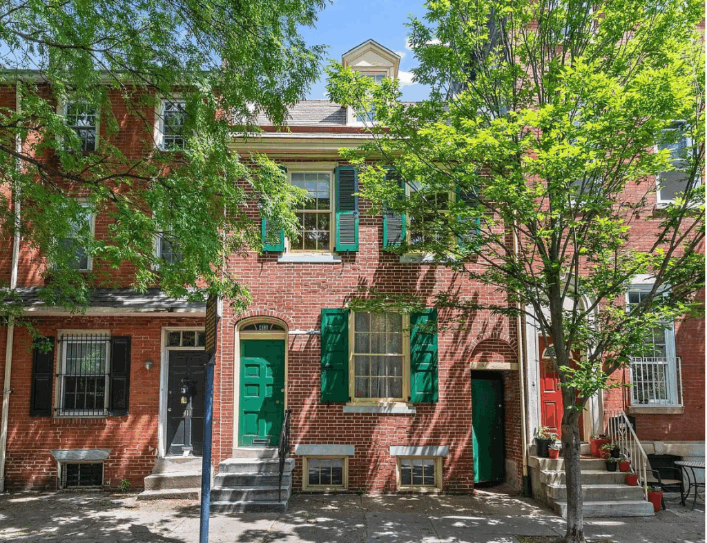 georgian style home with green accents