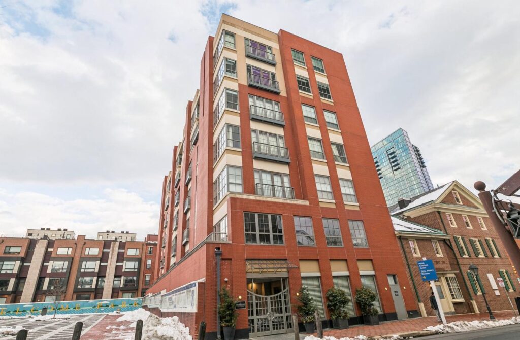 Exterior of The Moravian in Philadelphia featuring contemporary red-brick condominium architecture in the heart of Society Hill.